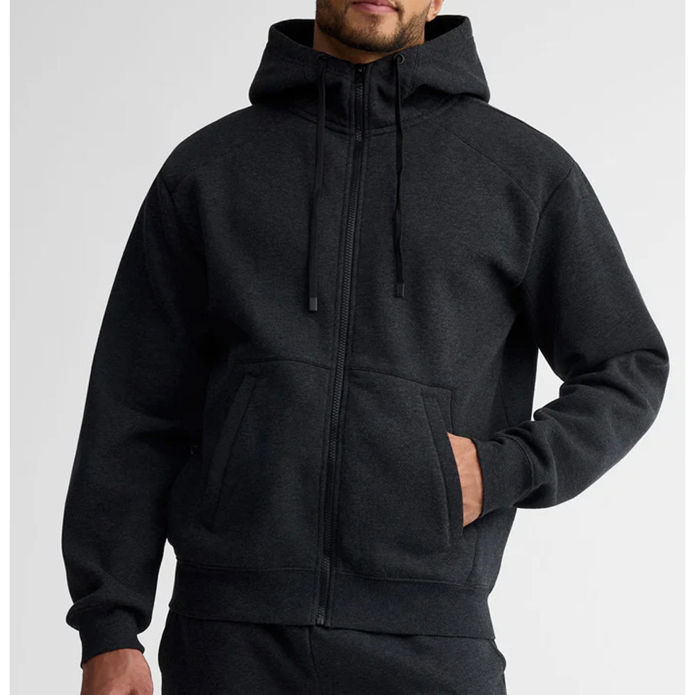 Person wearing a black hoodie on a light gray background