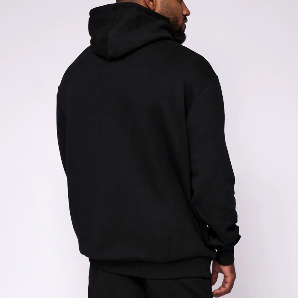 Person wearing a black hoodie from behind on a white background