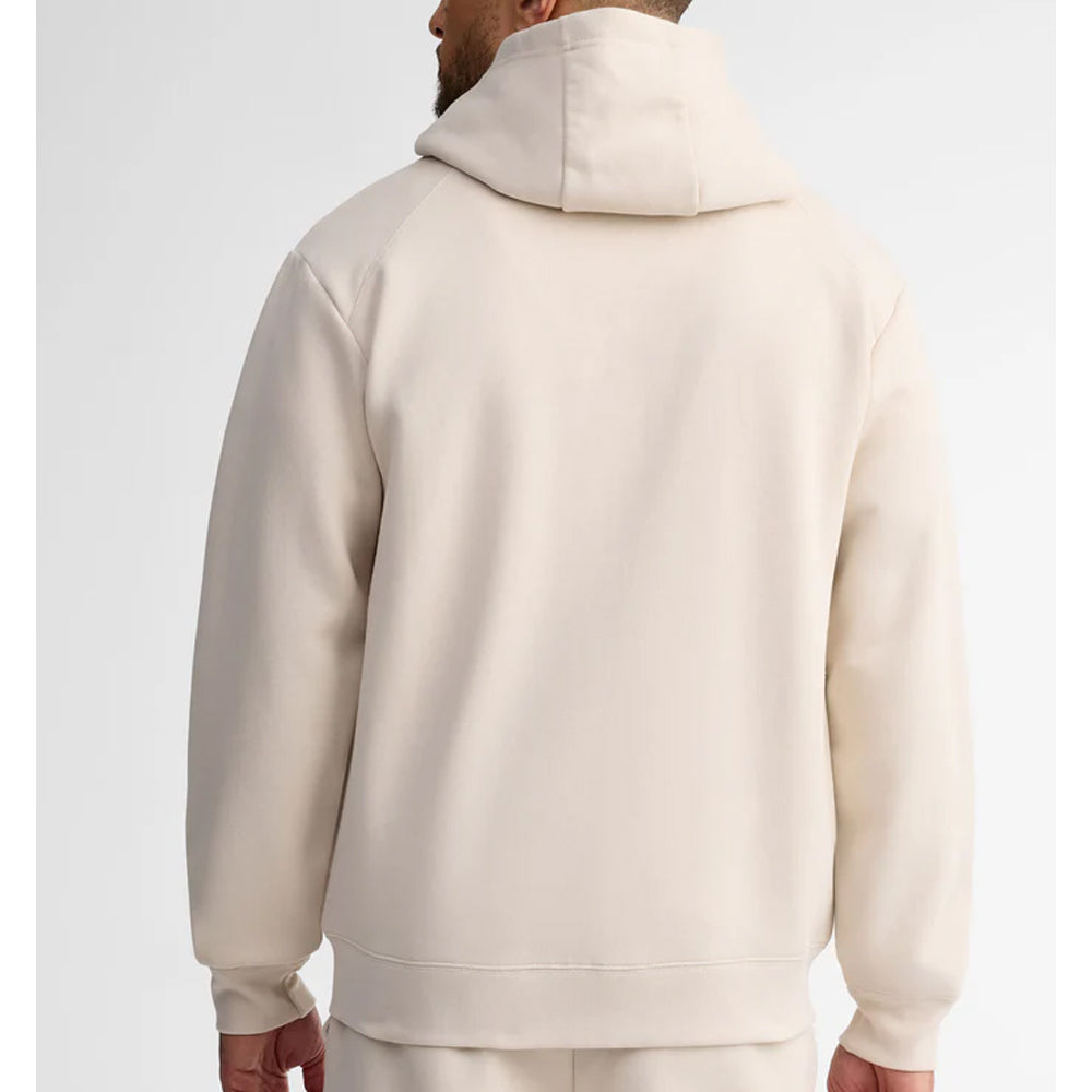 Person wearing a beige hoodie from behind on a white background