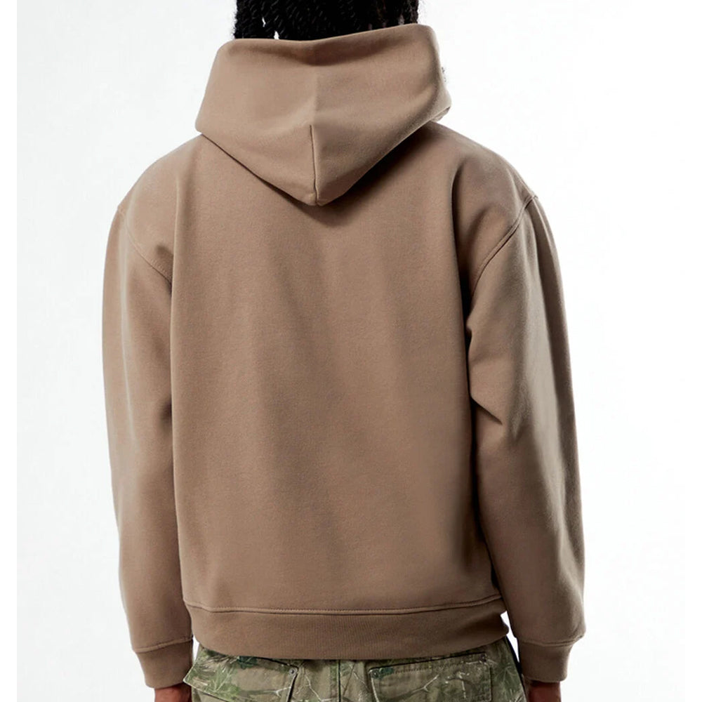 Brown hoodie worn by a person on a white background