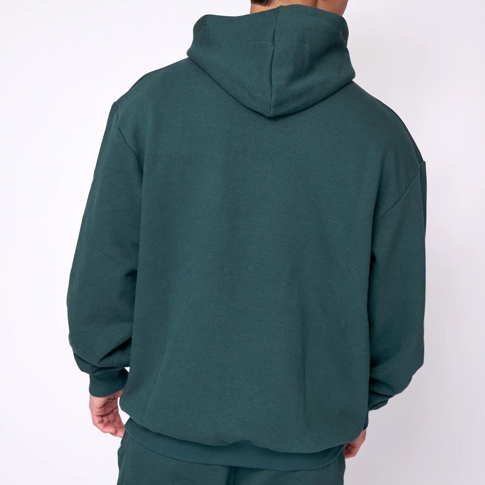 Green hoodie worn by a person on a white background