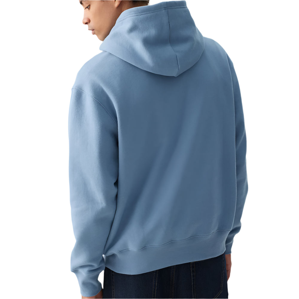 Person wearing a blue hoodie from behind on a plain background