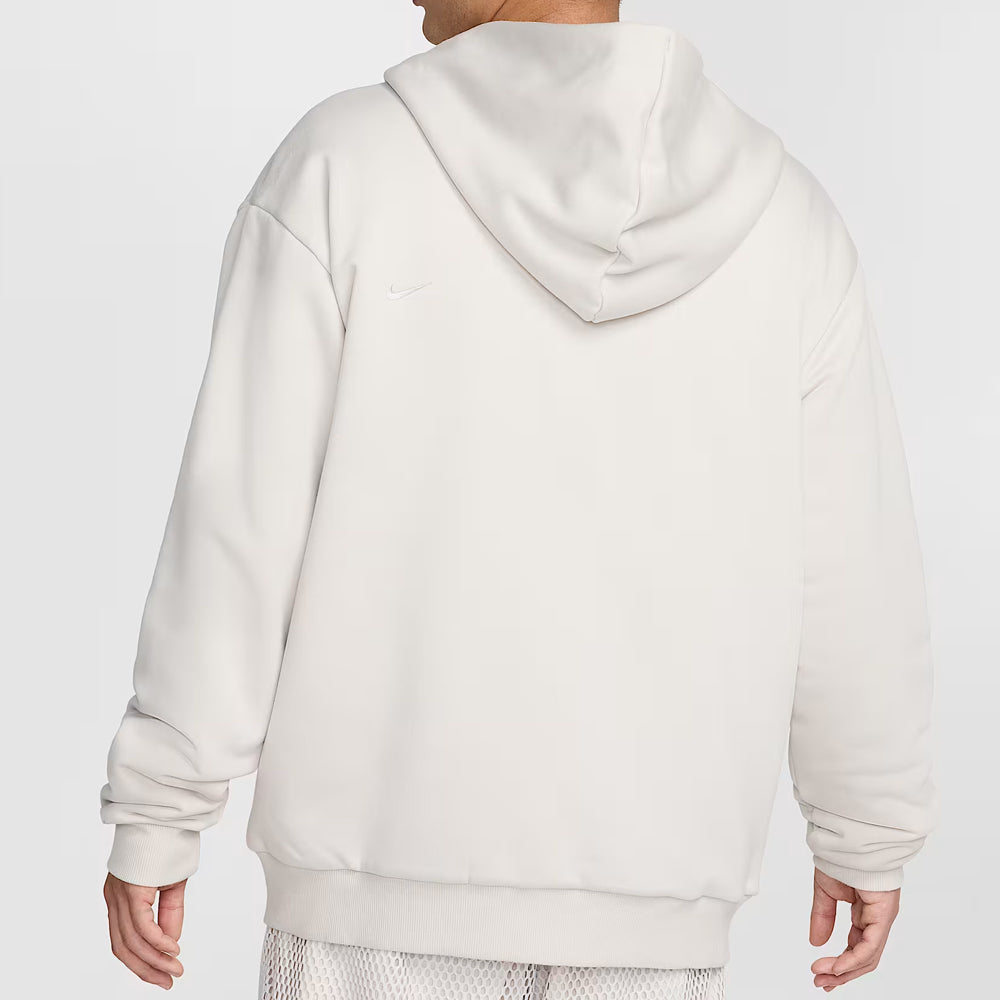 White hoodie worn by a person on a light gray background