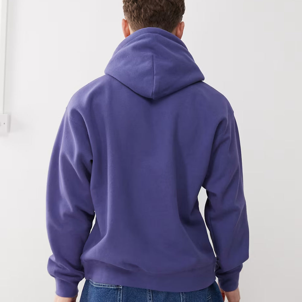 Person wearing a purple hoodie from behind on a white background