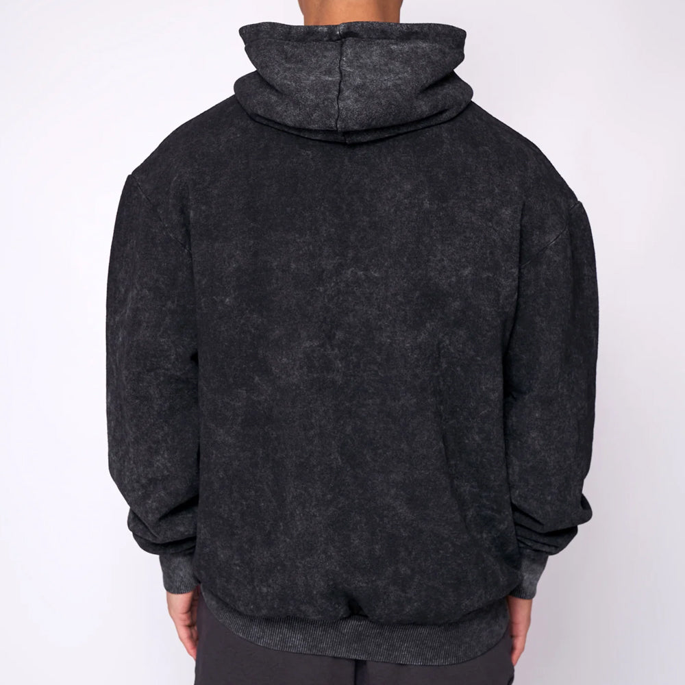 Dark gray hoodie worn by a person on a white background