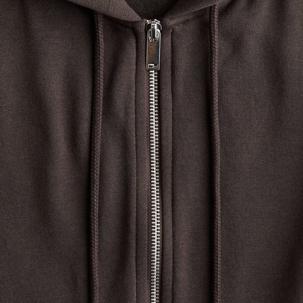 Close-up of a brown hoodie with a zipper