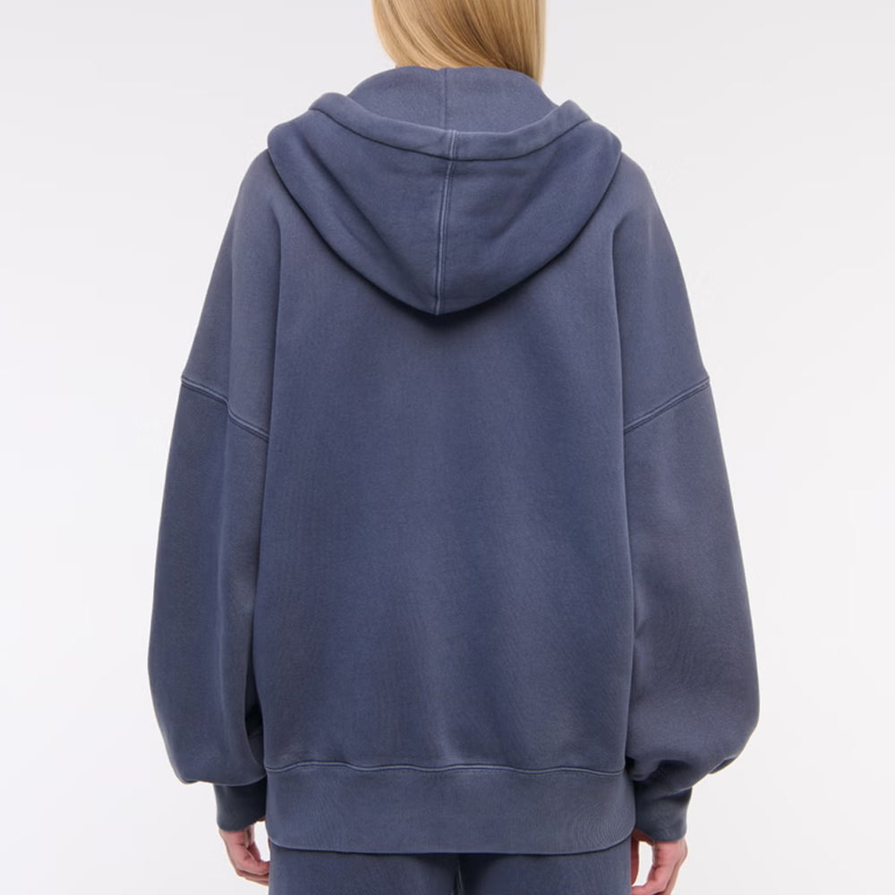 Person wearing a blue hoodie on a white background