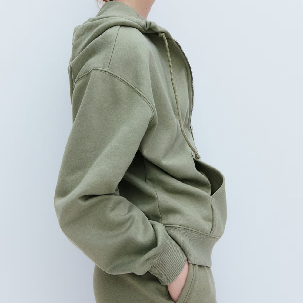 Green hoodie on a white background