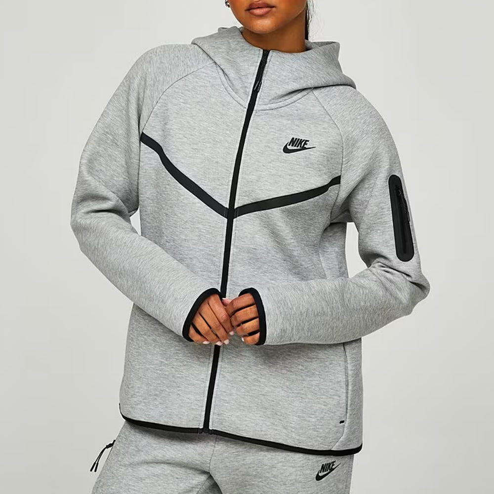 Gray Nike tracksuit with black accents on a light gray background