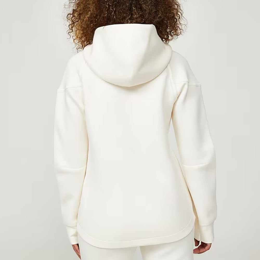 Person wearing a white hoodie from behind on a plain background