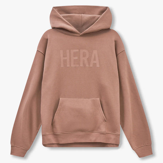 Brown hoodie with 'HERA' branding on the back against a light gray background