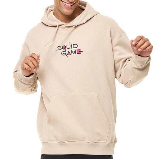 Person wearing a beige hoodie with 'Squid Game' logo on a white background