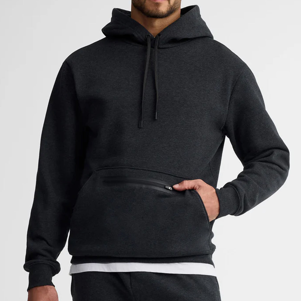 Person wearing a black hoodie on a light gray background