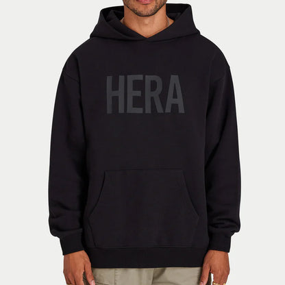Black hoodie with 'HERA' text on a white background