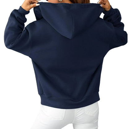 Navy blue hoodie worn by a person on a white background