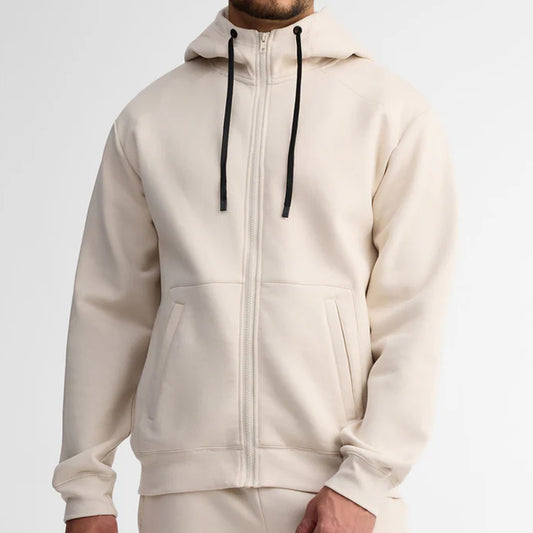 Beige hoodie with a zipper on a plain background