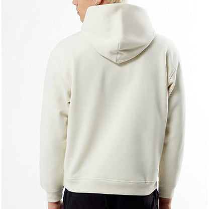 Person wearing a beige hoodie from behind on a white background