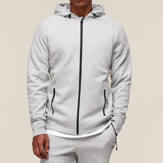 Gray tracksuit with a zipper on a beige background