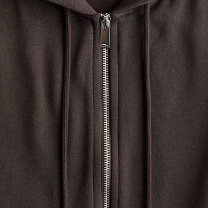 Close-up of a brown hoodie with a zipper