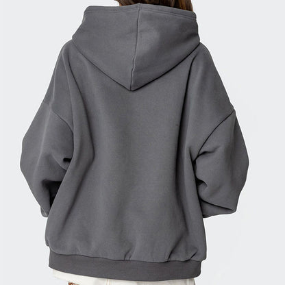 Gray hoodie worn by a person on a light gray background