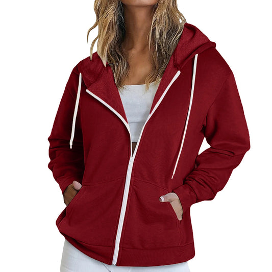 Red hoodie with white trim worn by a person on a white background