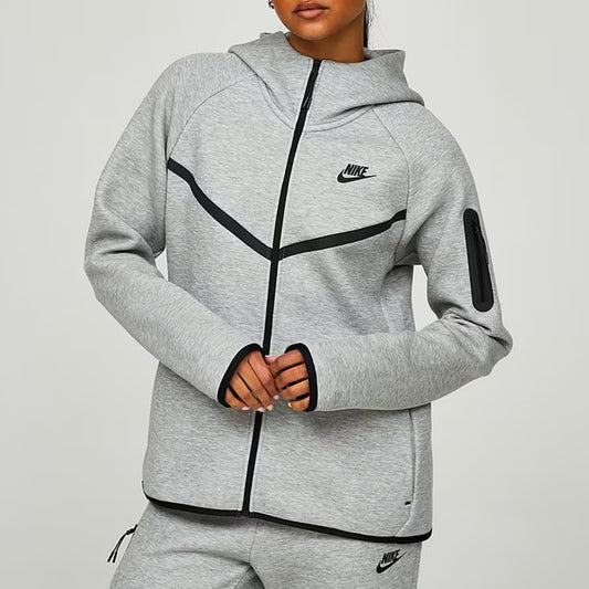 Gray Nike tracksuit with black accents on a light gray background